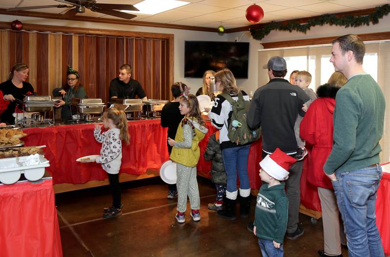 Families line up for breakfast at Breakfast with Santa in Elburn on Sunday, Dec. 4, 2022.