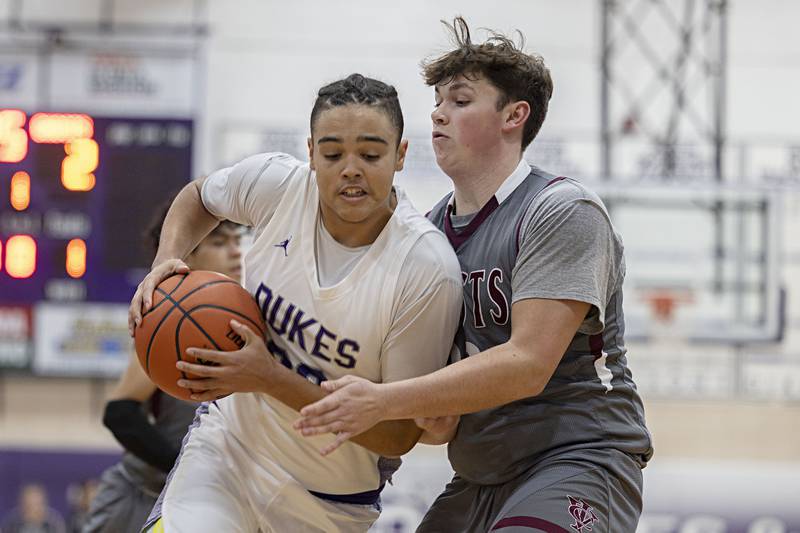 Dixon’s Darius Harrington works below the basket Tuesday, Dec. 20, 2022 against IVC.