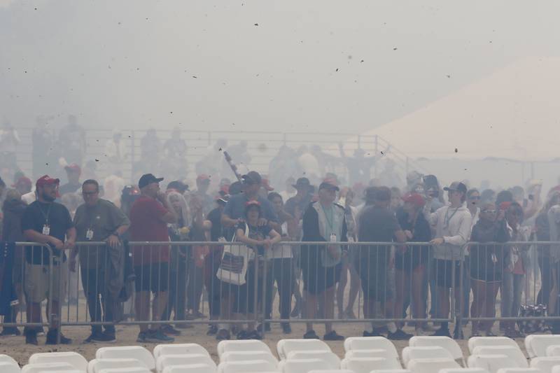 Smoke from the fireworks engulf the crowd during the Trump Now-Save the American Dream Rally at the McHenry County Fairgrounds on Sunday Aug. 18, 2024, in Woodstock.