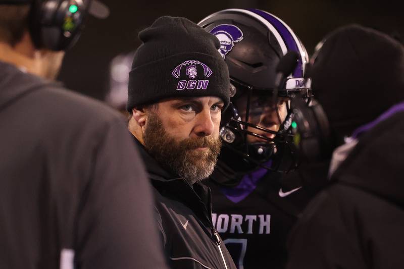 Downers Grove North head coach Joe Horeni huddles up during a time out against Mt. Carmel in the Class 7A championship on Saturday, Nov. 25, 2023 at Hancock Stadium in Normal.