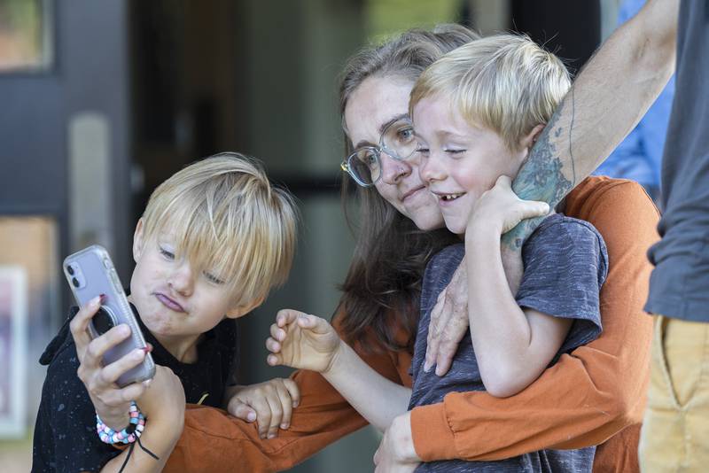 Stephanie Reitzel snaps a selfie with sons Vann (left) 5, and Nolan, 6, Wednesday, August 16, 2023 at Washington School in Dixon. First grader Nolan started school on this day.