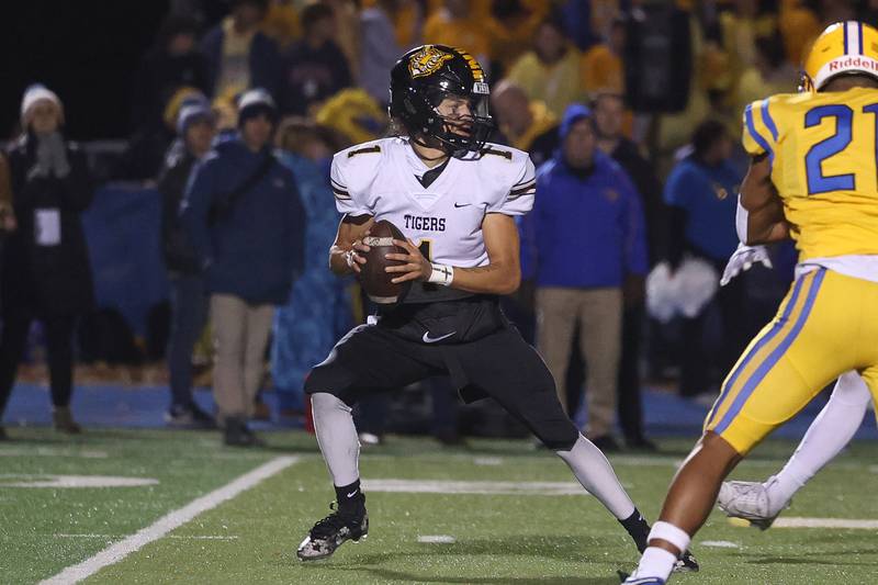 Joliet West’s Antoine Brooks drops back to pass against Lyons Township in the first round of the playoffs on Friday, Nov. 1, 2024 in La Grange.