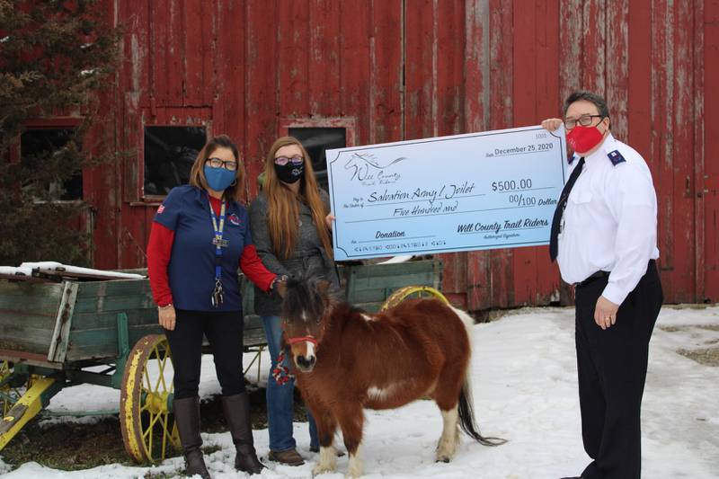 The Will Country Trail Riders recently donated $500 to the Salvation Army in Joliet. Pictured are Linda Trevino of the Salvation Army, Noelle Niller of the Will County Trail Riders and Envoy Scott Hurula of the Salvation Army.