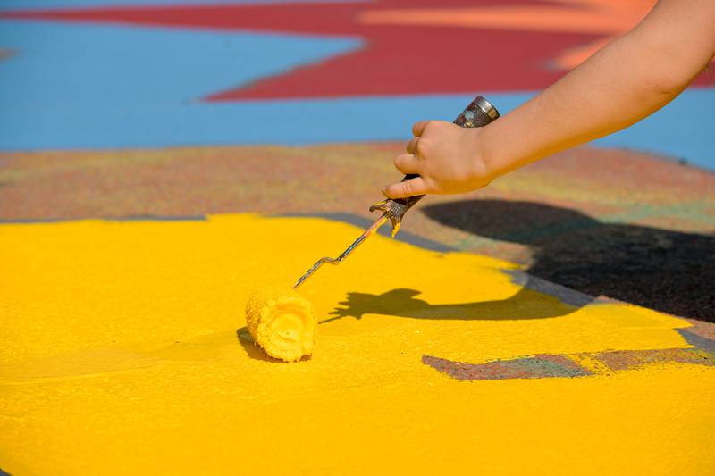 A multi colored street mural comes to life at the intersection of Walnut and Riverside Avenues during the St. Charles Art Council’s “Paint the Riverside” event on Saturday, May 10, 2025 in St. Charles.