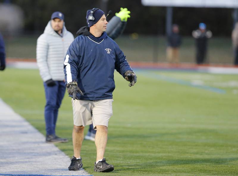 IC Catholic's head coach William Krefft walks the sidelines during the Class 3A varsity football semi-final playoff game between Byron High School and IC Catholic Prep on Saturday, Nov. 19, 2022 in Elmhurst, IL.