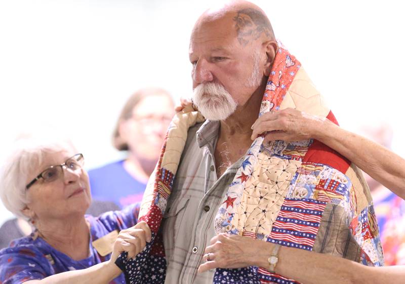 Members of the Princeton High School band play during the Quilt of Valor Tribute to Veterans ceremony on Wednesday, Aug. 20, 2025 at the Bureau County Fair in Princeton.