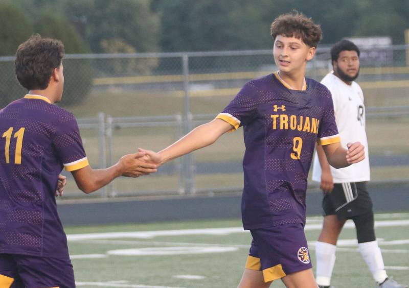 Mendota's Abel Nanez hi-fives teammate Casar Casas after scoring a goal during the Three Rivers Tournament on Thursday, Oct. 2, 2025 at Mendota High School.