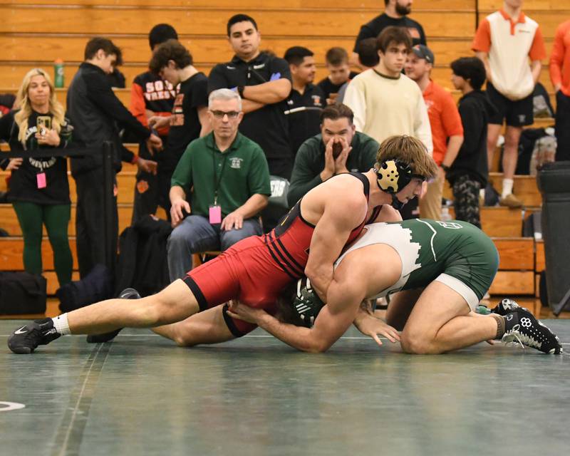 Batavia wrestler Ben Brown, left, keeps a hold of Glenbard West Sasha Boulton in the 190 weight class regional title match where  Ben took the win on Saturday Feb. 3, 2024, held at Glenbard West High School.