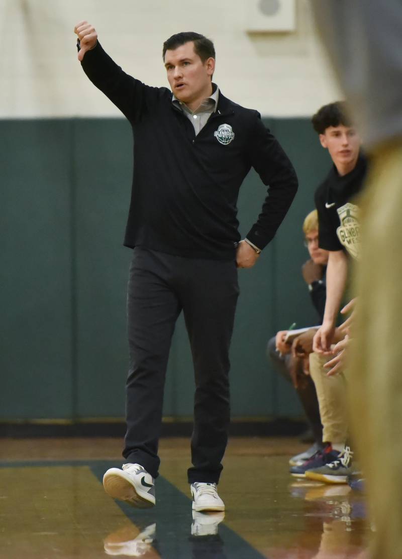 John Starks/jstarks@dailyherald.com
Glenbard West coach Jason Opoka signals his team against Glenbard South in a boys basketball game in Glen Ellyn on Monday, November 21, 2022.