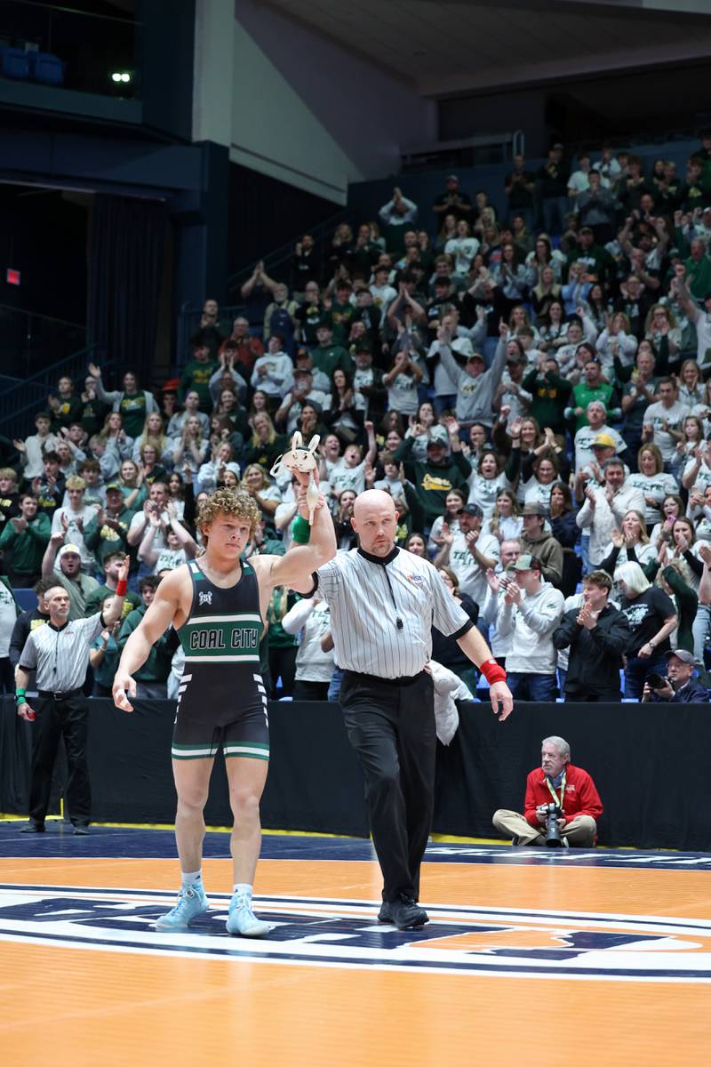 Coal City's Brody Widlowski claims the 150-pound match win as the fan section erupts during the Coalers' IHSA Class 1A Dual Team State championship victory over Vandalia on Saturday, Feb. 28, 2026.