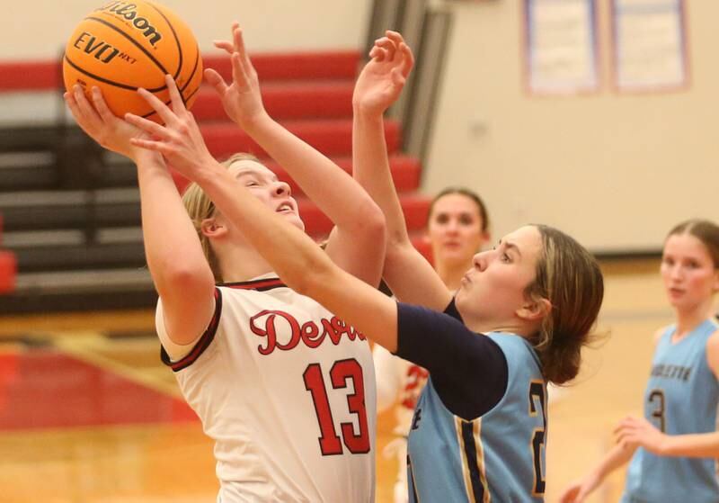 Hall's Leah Pelka eyes the hoop as Marquette's Kaitlyn Davis defends on Thursday, Feb. 13, 2025 at Hall High School.