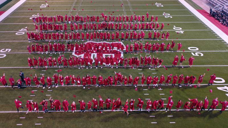 La Salle-Peru Township High School class of 2024 students throw their caps in the air during the 126th annual commencement graduation ceremony on Thursday, May 16, 2024 in Howard Fellows Stadium.