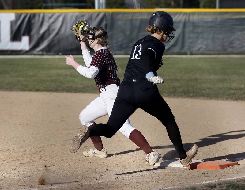 Prairie Ridge's M-K Center forces out Huntley's Grace Benson as she runs to first base during Fox Valley Conference softball game on Monday, April 14, 2025, at Prairie Ridge High School in Crystal Lake.