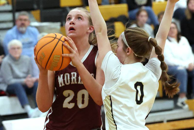 Morris’ Landrie Callahan goes to the basket against Sycamore's Cortni Kruizenga during their game Tuesday, Jan. 23, 2024, at Sycamore High School.