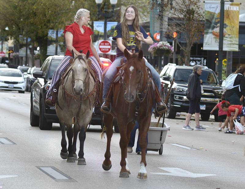 Horses bring up the rear on LaSalle St in Ottawa Wednesday evening during the school’s annual Ottawa High Homecoming Parade.