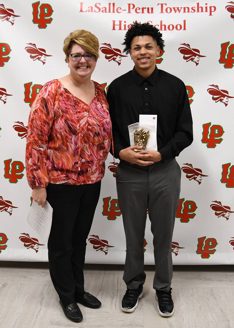 Jamaar Smith (right) received the 2023 Eldon Gunia Memorial Art Scholarship at La Salle-Peru High School.