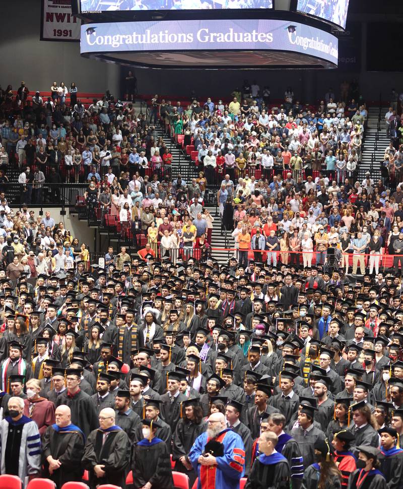 A sea of graduation candidates line the floor of the Convocation Center Saturday, May 14, 2022, during the first of two undergraduate commencement ceremonies at Northern Illinois University in DeKalb.