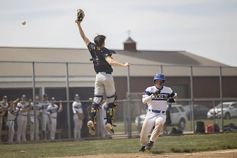 Sterling’s Ayden Schoon leaps for a high throw against Burlington Central  during a class 3A regional final in Rochelle Saturday, May 27, 2023.
