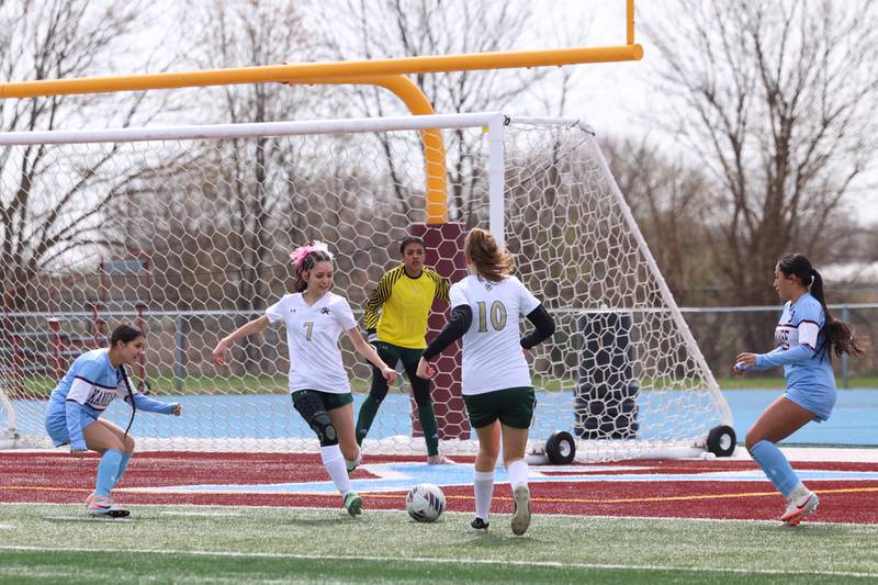 Bishop McNamara's Lily Walker-Dionne clears the ball away from Kankakee players during the Kays' 8-0 victory in the final All-City match on Saturday, April 11, 2026.