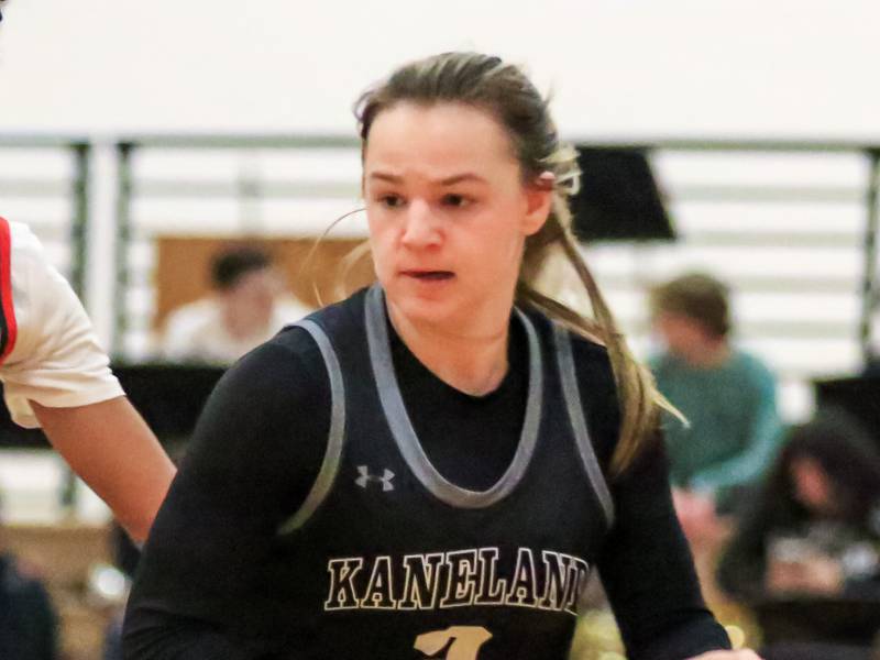 Kaneland's Kailey Plank (2) takes off to the basket while Yorkville's Alex Stewart (22) is screened by Brigid Gannon (5) during varsity basketball game between Kaneland at Yorkville. Dec 14, 2022.