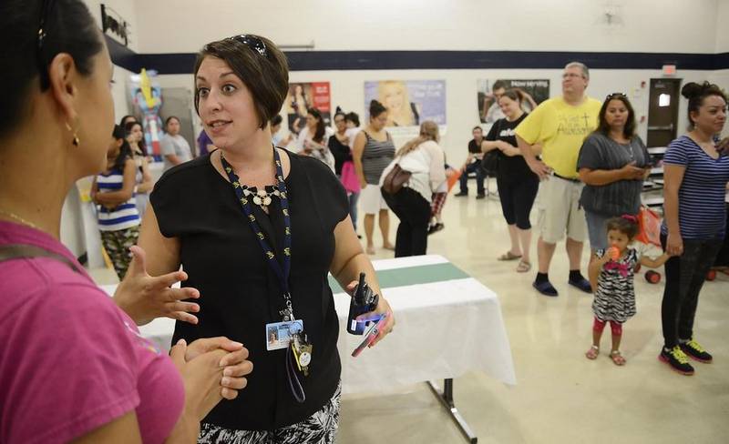 Principal Marcie Marzullo meets parents Monday, Aug. 17, 2015, at Ronald D. O'Neal Elementary School in Elgin before the first day of classes.