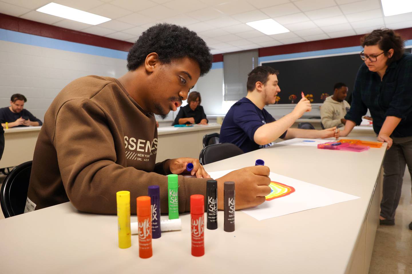 Kankakee School District student Jadyn Hill creates a rainbow during an art therapy session at Kankakee School District's Avis Huff Student Support Services Center on Thursday, Nov. 13, 2025.