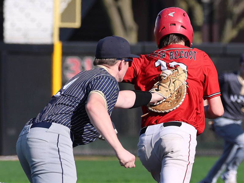 Hiawatha's Mason Alm tags out South Beloit's Macen Peot during a rundown after he was picked off Thursday, April 16, 2026, during their game at Northern Illinois University in DeKalb.