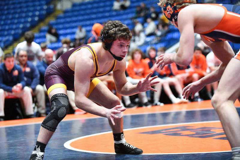 Will Konder of Montini wrestles Colton McClure of Mahomet-Seymour in the 144-pound match during the IHSA Dual Team State Finals in Bloomington on Saturday, March 1.