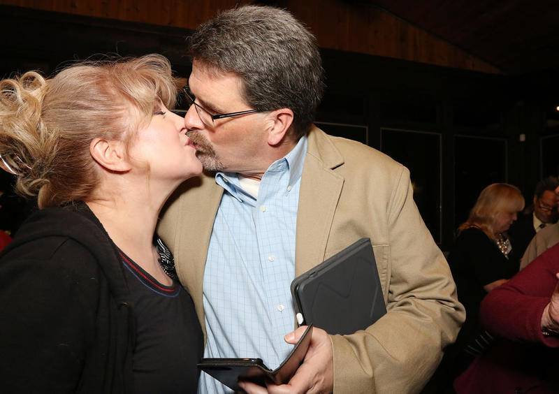 McHenry County Clerk-elect Joe Tirio kisses his wife, Karen, after winning the election Tuesday at Bulldog Ale House in McHenry.