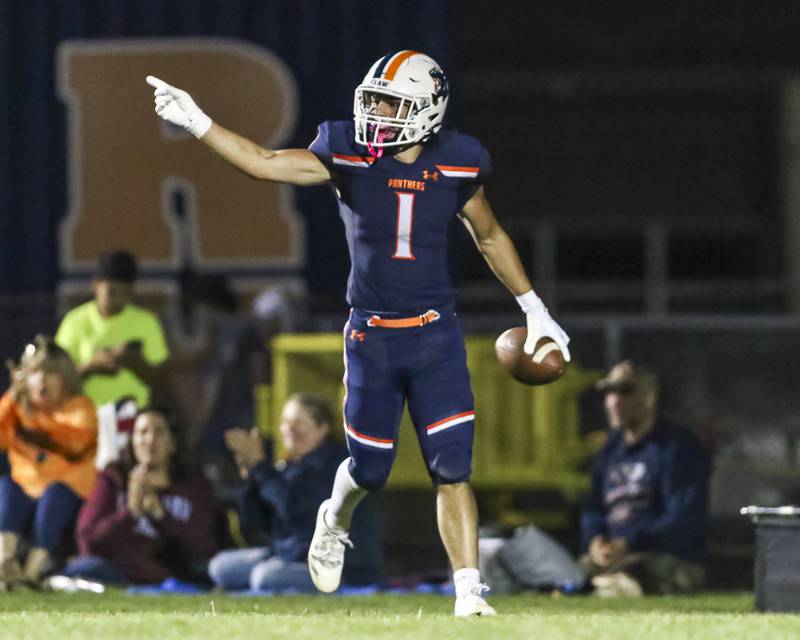 Oswego's Teddy Manikas (1) celebrates his touchdown catch and run during football game between Bolingbrook at Oswego Friday, Sept 12, 2025  in Oswego.