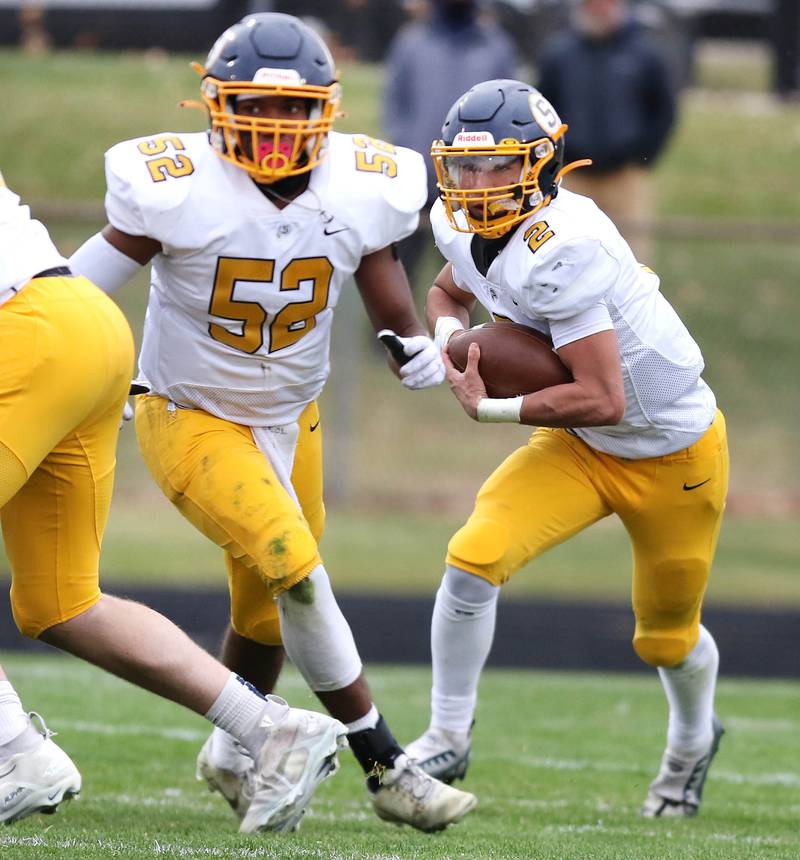 Sterling's JP Schilling follows blocker Christian Beasley during their Class 5A state playoff game Saturday, Nov. 12, 2022, at Sycamore High School.