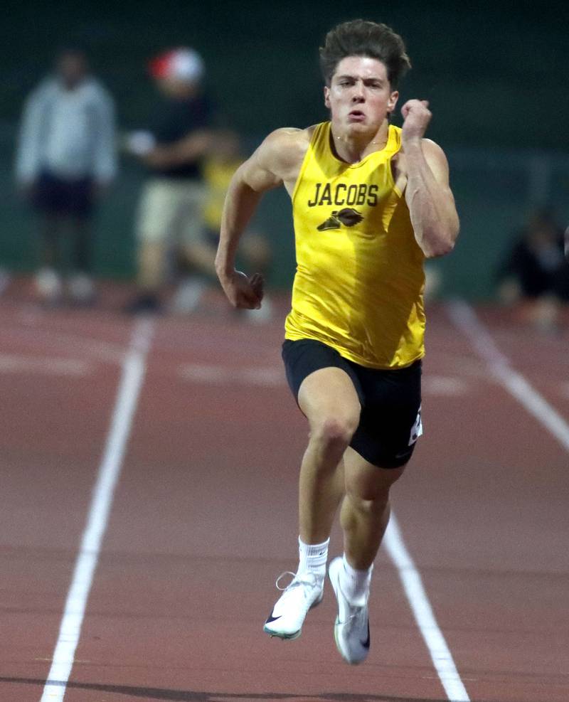 Jacobs’ Matt Scardina competes in the 100-meter dash in Fox Valley Conference boys track and field meet action at Huntley High School in Huntley on Thursday, May 15, 2025.
