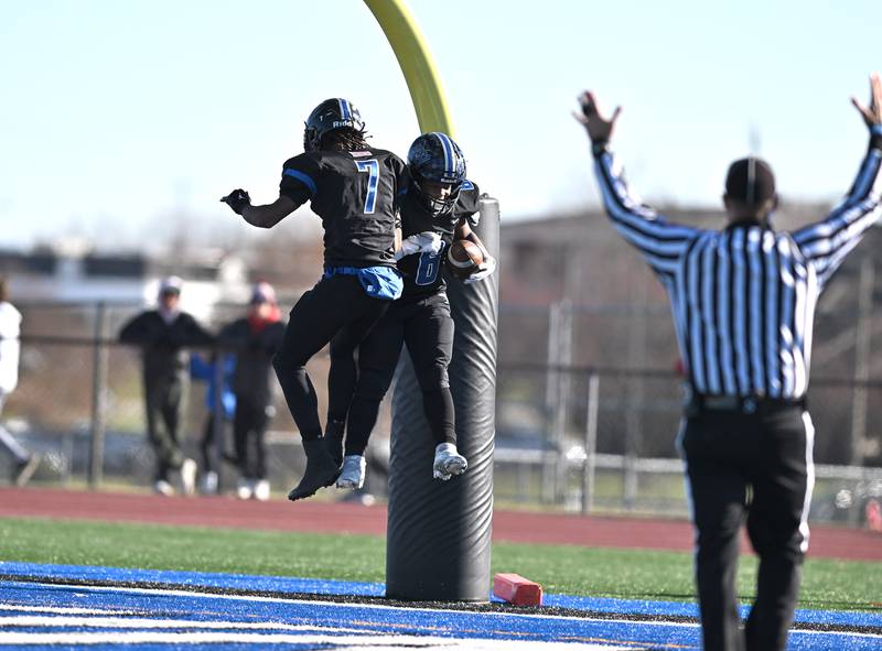 Lincoln-Way East's Nuri Muhammad (6) and DJ Richardson (7)celebrate in the end zone during the IHSA class 8A semifinals playoff game against Barrington on Saturday, Nov. 18, 2023, at Frankfort. (Dean Reid for Shaw Local News Network)