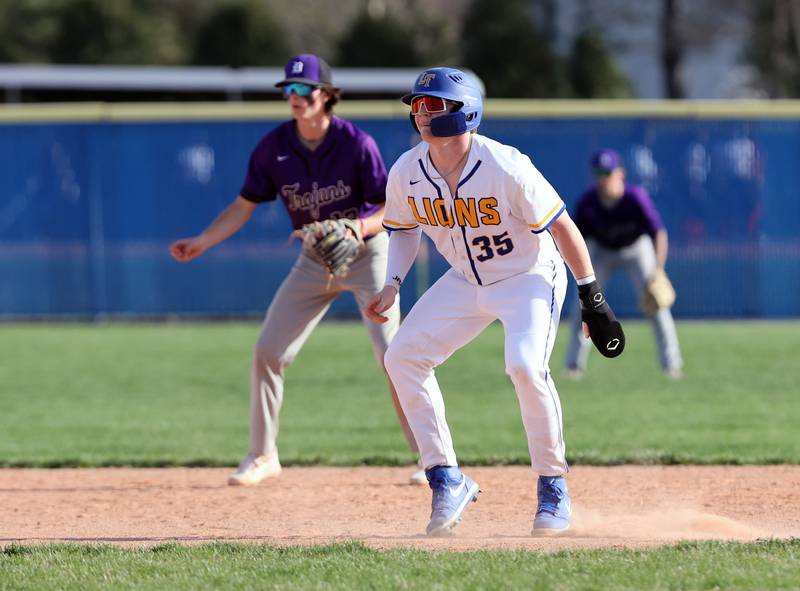 Lyons Township's Troy Stukenberg (35) takes a lead off of second base during the boys varsity baseball game between Lyons Township and Downers Grove North high schools in Western Springs on Tuesday, April 11, 2023.