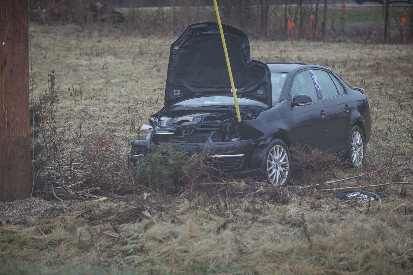 A car crashed into a ditch and entangled in utility pole wires after a two-vehicle crash on Dec. 28, 2025 along Route 23 near Marengo.