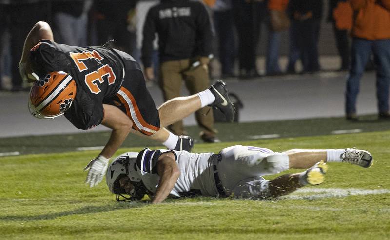 Byron’s Caden Considine runs over Dixon’s Landon Knigge for a TD Friday, Sept. 5, 2025, at Byron High School.