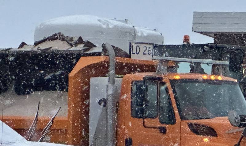 A salt truck fills a snow plow on Thursday, Jan. 2, 2025 at the Illinois Department of Transportation yard off of Interstate 80 near Ladd.