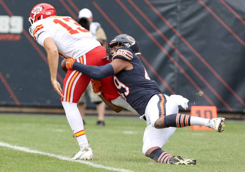 Chicago Bears linebacker Charles Snowden tries to wrap up Kansas City Chiefs quarterback Dustin Crum during their preseason game Aug. 13, 2022, at Soldier Field in Chicago.