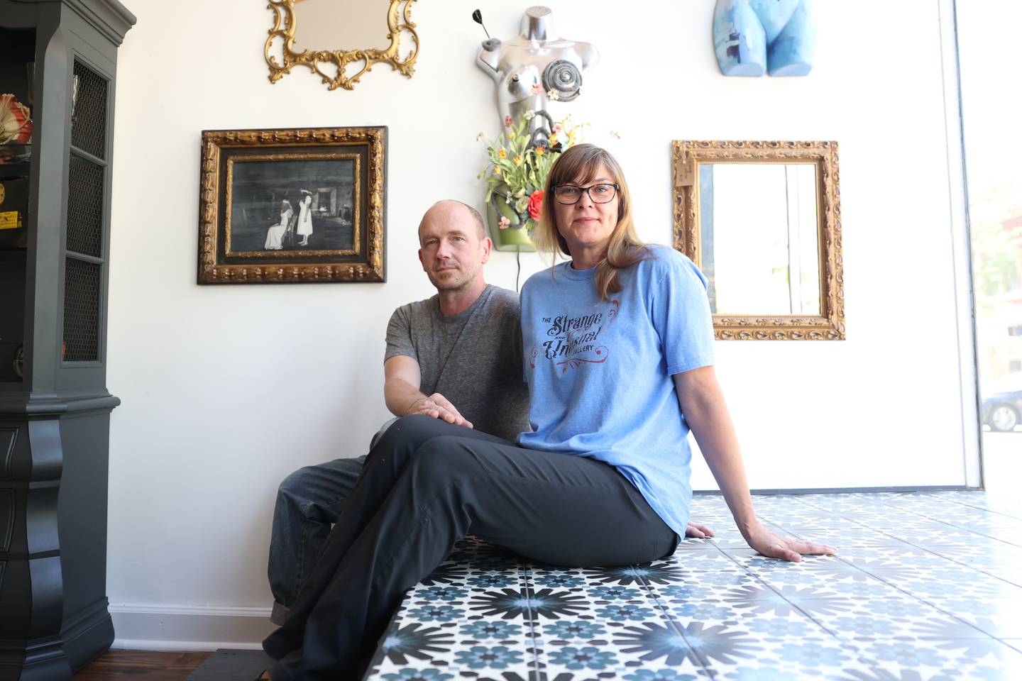 Terry and Christine Nordstrom pose for a photo at their gallery Strange and Unusual Gallery in Downtown Joliet on Friday, May 26, 2023.