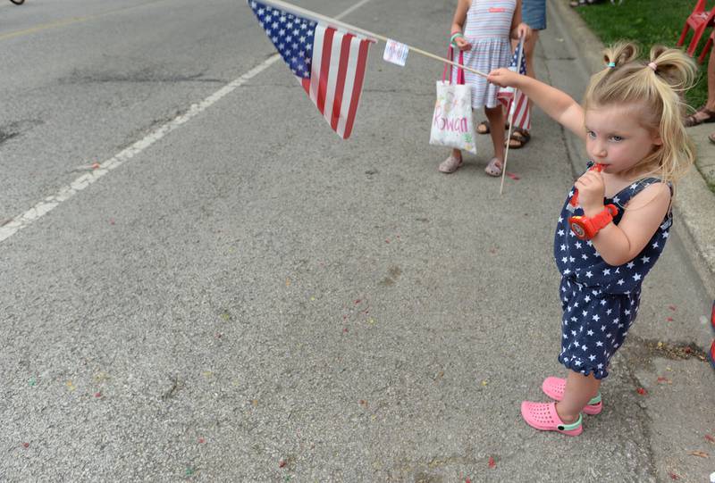 Ryder Wysopal of Brookfield waves her flag while attending the Brookfield 4th of July parade  Friday July 4, 2025.