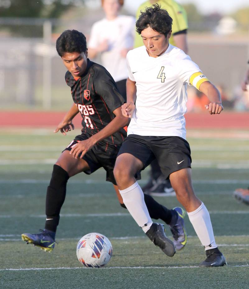 Sycamore's Willie Romero holds off DeKalb's Henry Garcia-Alvarez during their game Tuesday, Oct. 4, 2022, at DeKalb High School.