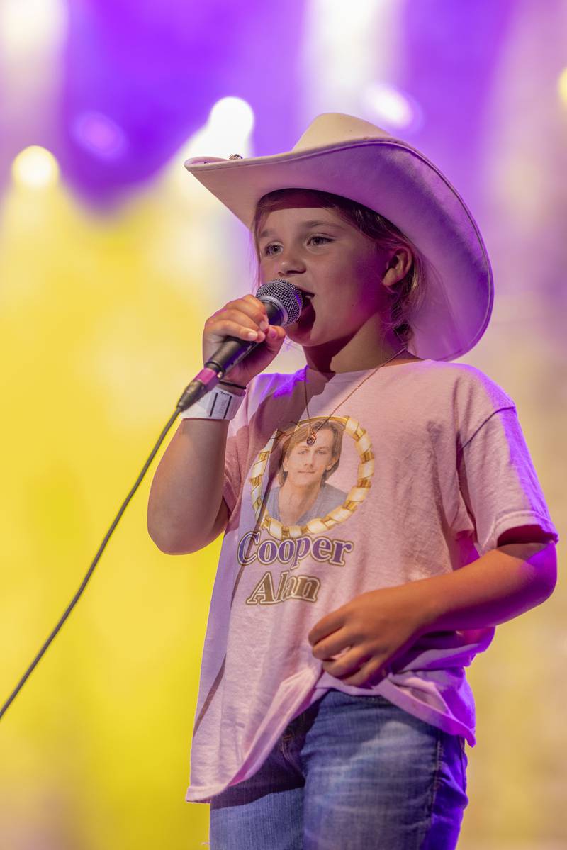 Cooper Alan fan Landyn Boltz was asked to come up on stage to sing along for a song during Alan's set at Streatorfest on August 2, 2024.