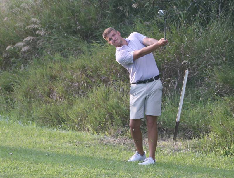 Bailey Lehr swings for the green during the Illinois Valley Mens Golf Championship Tournament on Sunday, July 27, 2025 at Spring Creek Golf Course in Spring Valley.