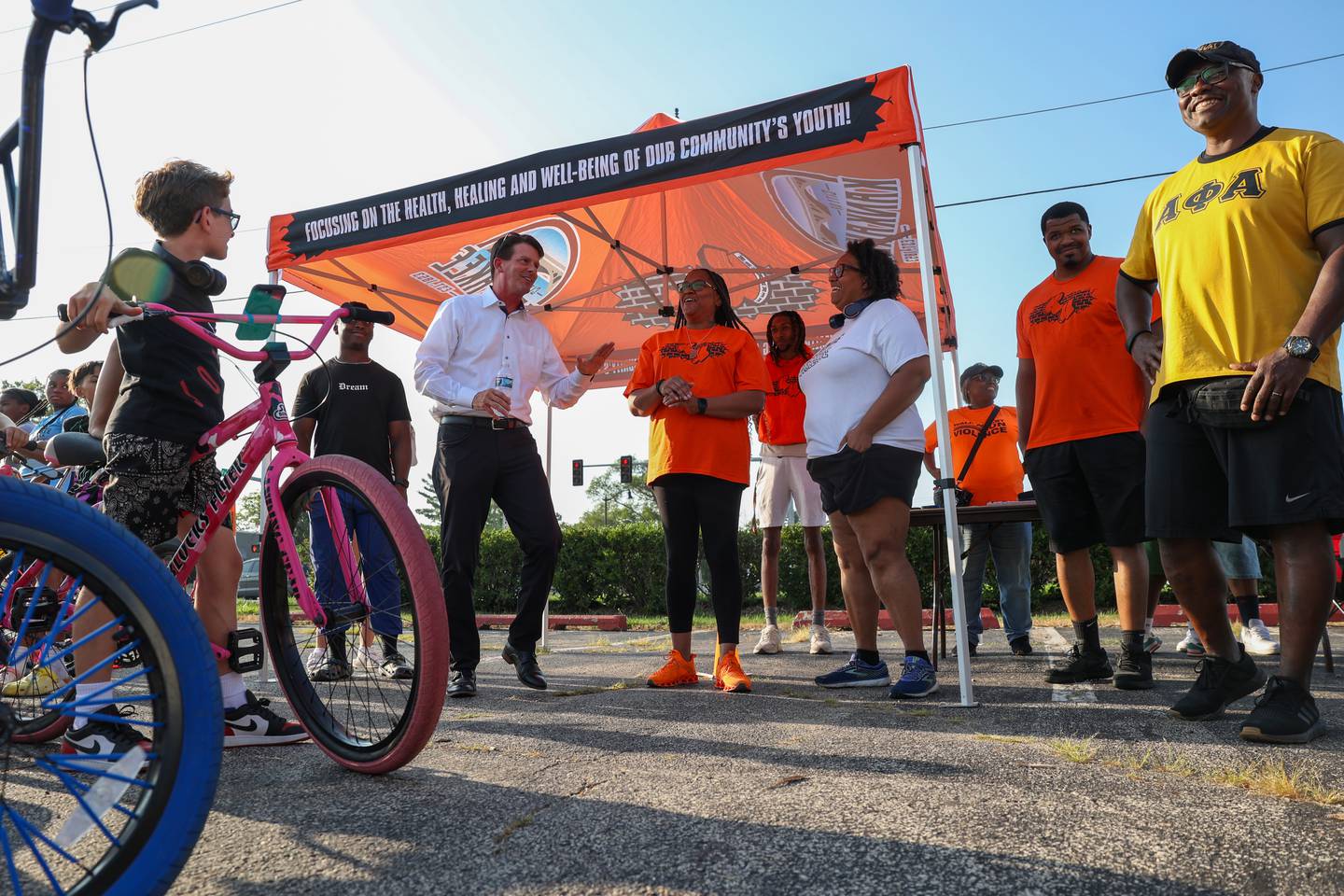 Kankakee Mayor Chris Curtis, left of center, speaks to the group ahead of the annual Bike Against Violence ride on Tuesday, July 22, 2025, at the Youth For Christ City Life Center in Kankakee. Also on hand for the event were, from right, Kankakee Police Deputy Chief Donell Austin, also a Kankakee United committee member, Kankakee United outreach coordinator Troy Luie, committee member Rhonda Currie and violence prevention director Johnnie Graham-Wicks.