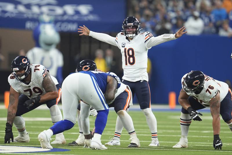 Chicago Bears quarterback Caleb Williams (18) signals during the first half of an NFL football game against the Indianapolis Colts Sunday, Sept. 22, 2024, in Indianapolis. (AP Photo/Michael Conroy)