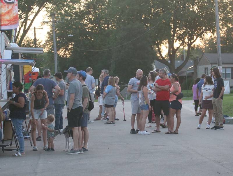 People wait in line at food vendors during the Taste of the Illinois Valley festival on Saturday, Aug. 3, 2024 at Centennial Park in Peru.