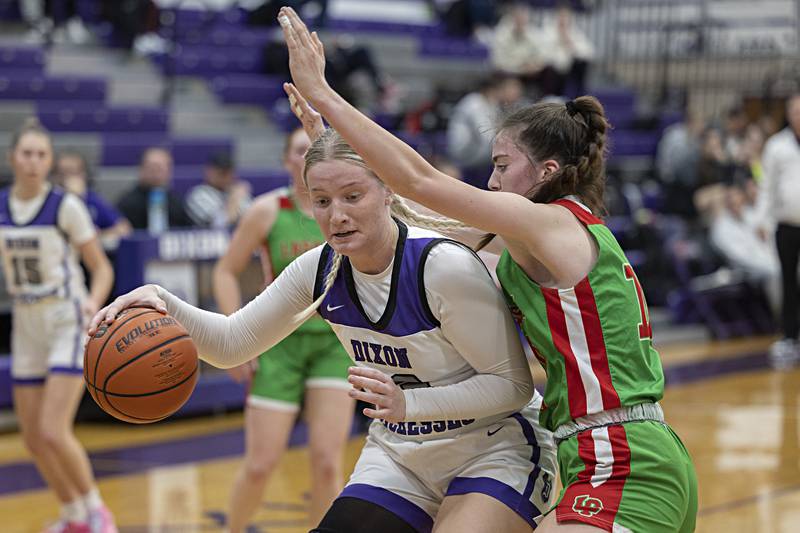 Dixon’s Jessie Pitman works against LaSalle-Peru’s Bailey Pode Thursday, Nov. 30, 2023 in Dixon.