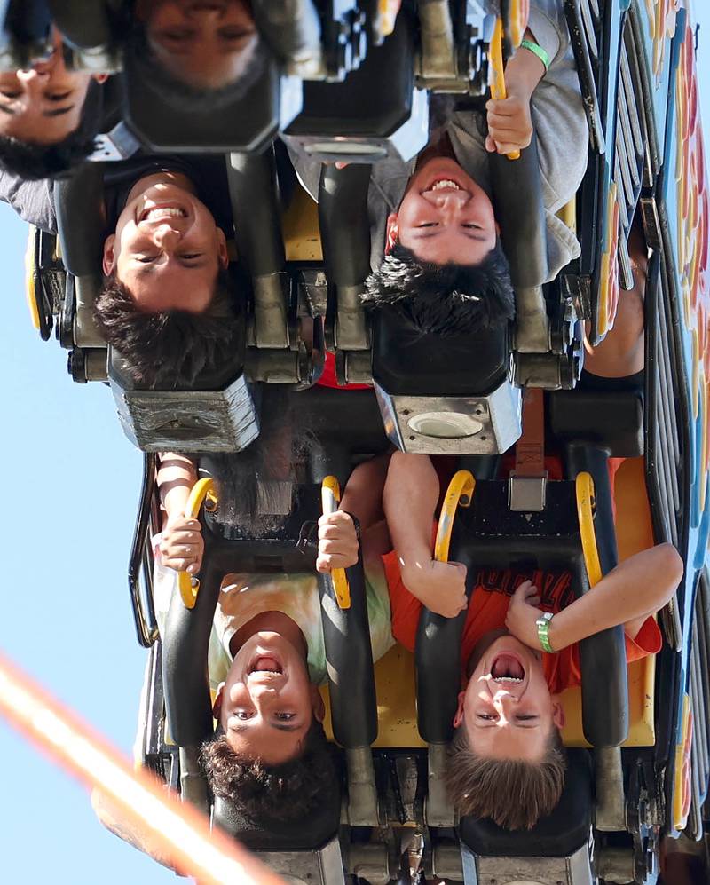 Visitors go upside down as they take on one of the rides at the carnival Friday, Aug. 23, 2024, during the DeKalb Corn Fest.