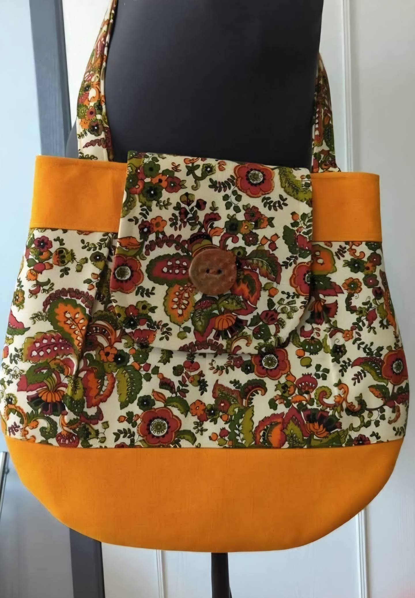 Some of the purses made by Not Your Grandma’s Aprons feature buttons made by Pots on Fox, which creates buttons on a pottery wheel.