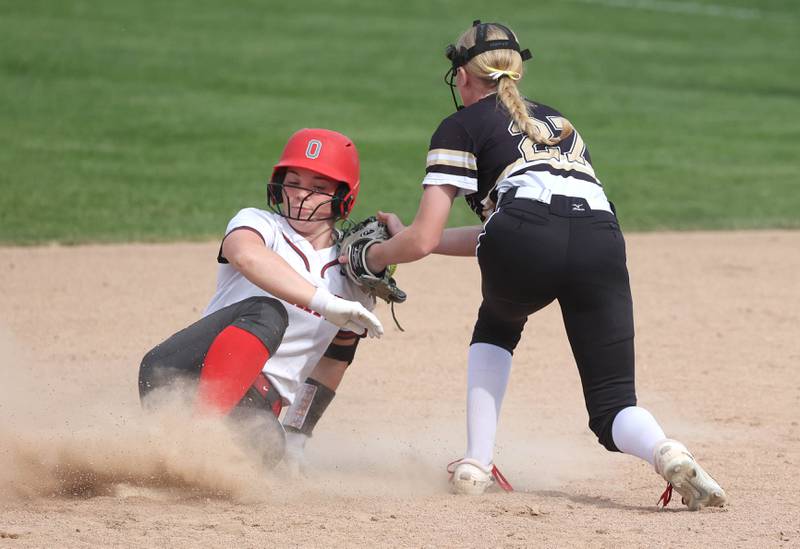 Ottawa’s Maura Condon slides into second safely as Sycamore's Keera Trautvetter applies the tag during their game Thursday, May 2, 2024, at Sycamore High School.
